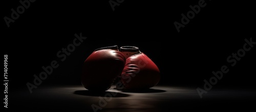 boxing gloves are on the ring with a beam of light with smoke