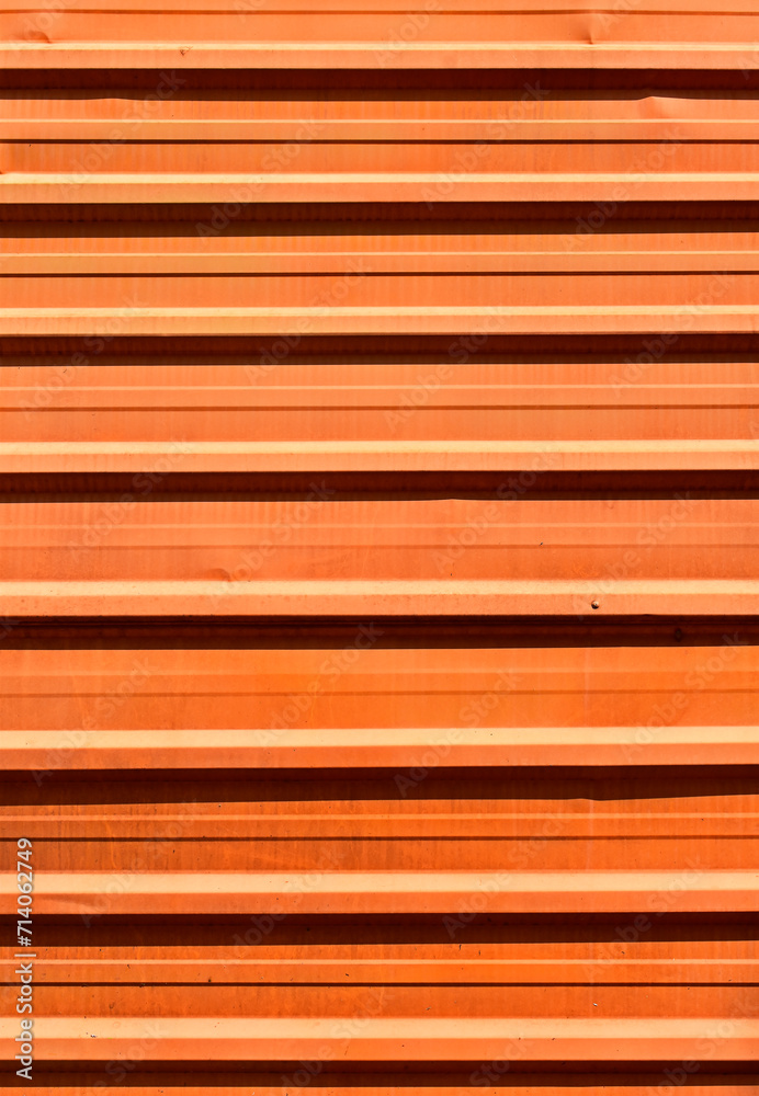 Fototapeta premium Orange corrugated metal plate surrounding wasteland