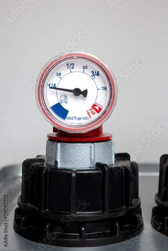 Home heating oil tank gauge registering a quarter of a tank full