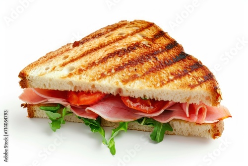 A half toasted ham and tomato sandwich isolated on white