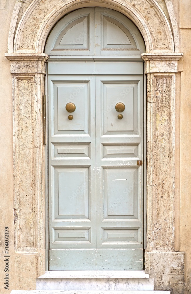 doors of Rome. Classic old wooden door in a public place on a city street or in an urban environment