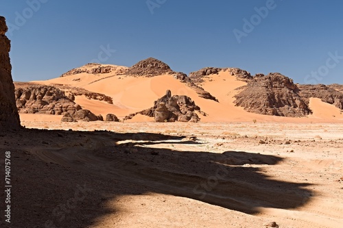 A view of the rock formations in the Tadrart Rouge Mountains. Tassili n Ajjer National Park, Sahara Desert, Algeria, Africa.