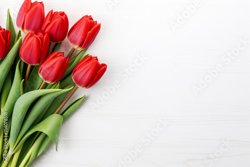 Beautiful red fresh spring tulips on white empty space