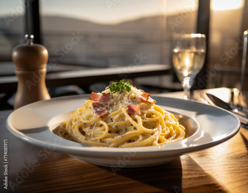 Delicious Carbonara Pasta with Bacon and Parmesan on White Plate