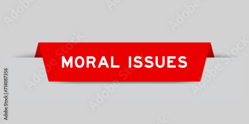 Red color inserted label with word moral issues on gray background