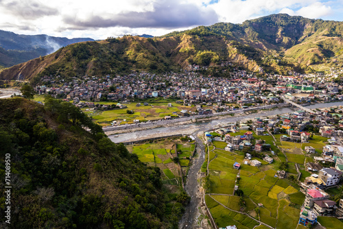 Aerial of the town of Bontoc, the capital of the landlocked province of Mountain Province, in the Cordillera Region of the Philippines. A valley town with terraced rice fields and residential areas.