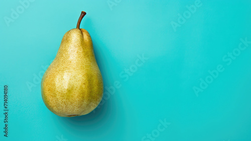 Blue hues background single pear fruit