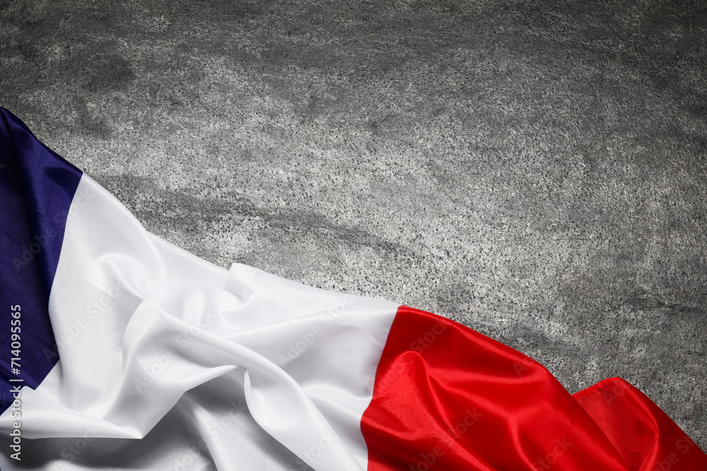 Flag of France on gray background, top view. Space for text