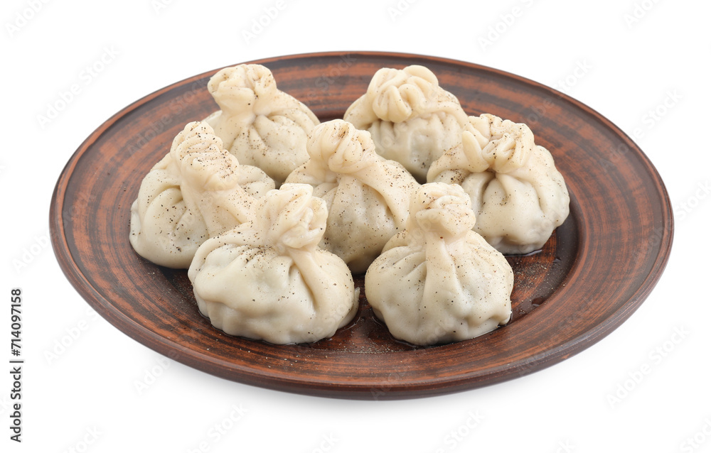 Plate with tasty fresh khinkali (dumplings) and spices isolated on white. Georgian cuisine Plate with tasty fresh khinkali (dumplings) and spices isolated on white. Georgian cuisine
