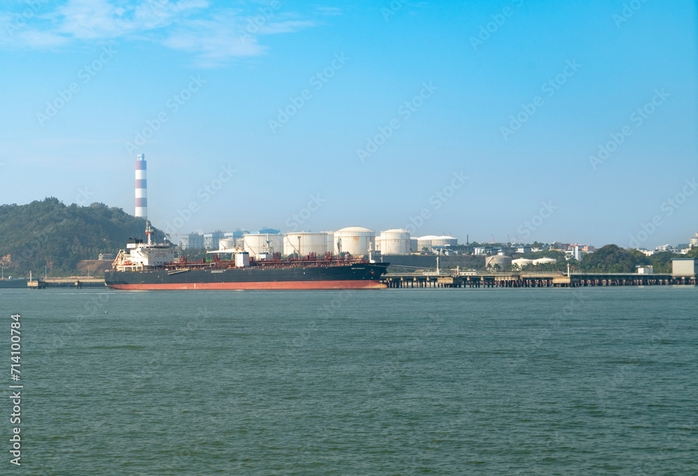 Ships docked at the port and city skyline, Xiamen, China