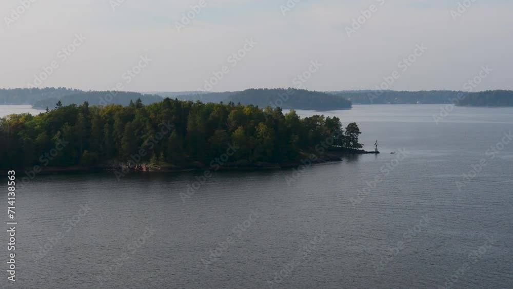 Island formation in peaceful and still sea water on a foggy morning, Archipelago, Sweden, nearby Stockholm. Island formation in peaceful and still sea water on a foggy morning, Archipelago, Sweden, nearby Stockholm.