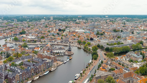 Haarlem, Netherlands. Windmill De Adriaan (1779). Windmill from the 18th century. Panoramic view of Haarlem city center. Cloudy weather during the day. Summer, Aerial View