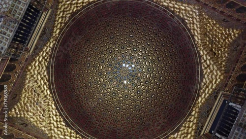 View of ceiling of Royal Alcazar of Seville is historic palace in Spain and formerly the site of the Islamic-era citadel of the city begun in the 10th century and then developed into larger complex 4k