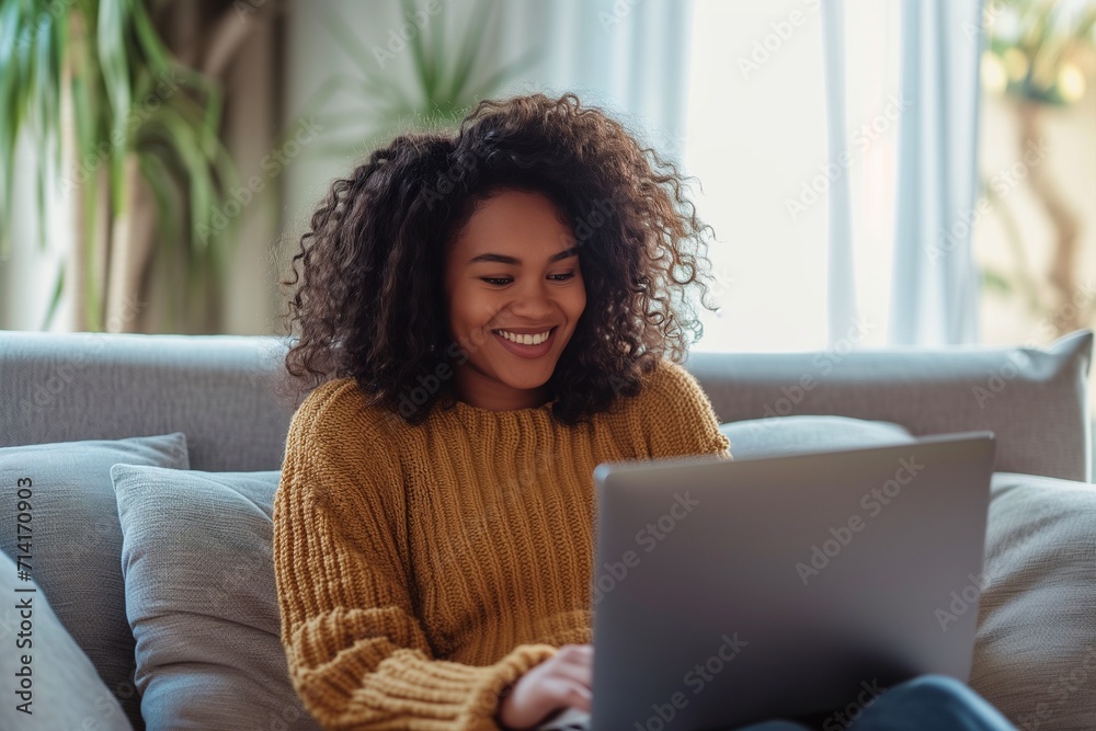 Woman Relaxing with Laptop in Comfortable Home Setting