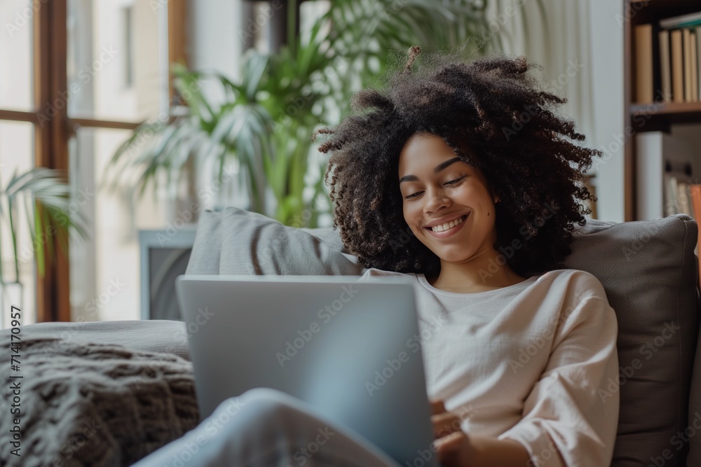 Woman Relaxing with Laptop in Comfortable Home Setting Woman Relaxing with Laptop in Comfortable Home Setting