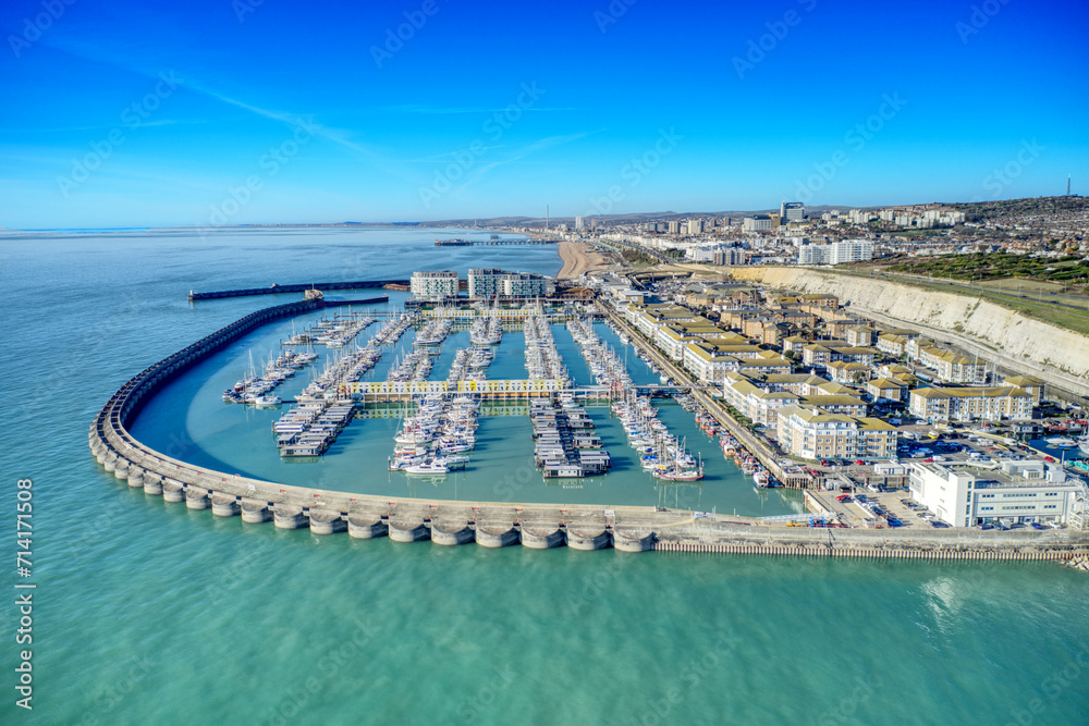 Aerial view of Brighton Marina in East Sussex, Southern England, with chalk cliffs and Brighton City in the background.