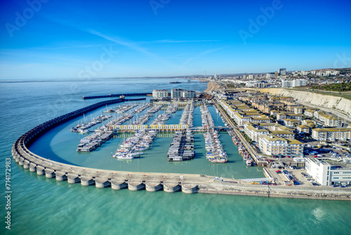 Aerial photo of Brighton Marina in East Sussex, Southern England, with chalk cliffs and Brighton City in the background.