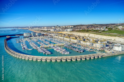 Brighton Marina in East Sussex, Southern England, with chalk cliffs and Brighton City in the background, Aerial photo from the sea. photo