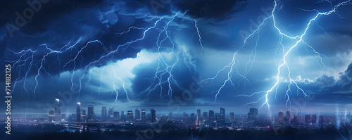 Lightning storms or striking over night city in blue light. photo