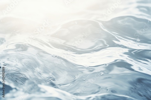 Blurred transparent water surface with waves and bubbles.