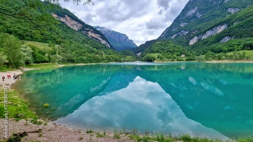Amazing beautiful turquoise lake Tenno in Trentino region of Italy, surrouded by Alps mountains. 4k HD video
 photo