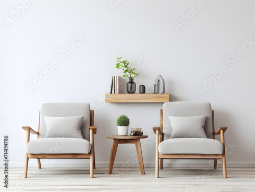 Beautiful living room with two chairs next to a wooden shelf in front of a white wall © tanjidvect