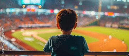 Boy enjoying professional baseball game photo
