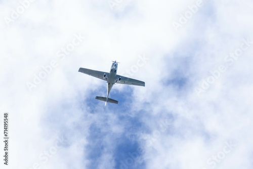Small plane. A single engine plane crosses the blue sky. Transportation.