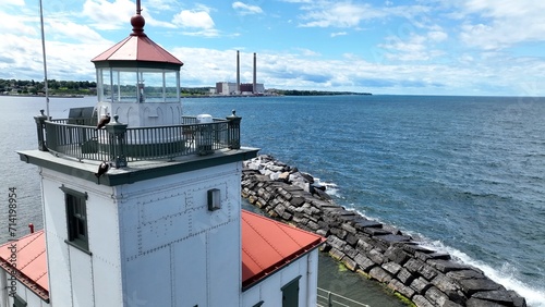 Lighthouse in Oswego New York close up on Lake Ontario at the mouth of Oswego River and harbor in small town on the coast of the Great Lake Historic Architecture Harbor beacon for boaters