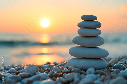 Experience tranquility through our image of a beach with a balanced pebble pyramid, symbolizing zen, meditation, and the soothing concept of balance and calmness.