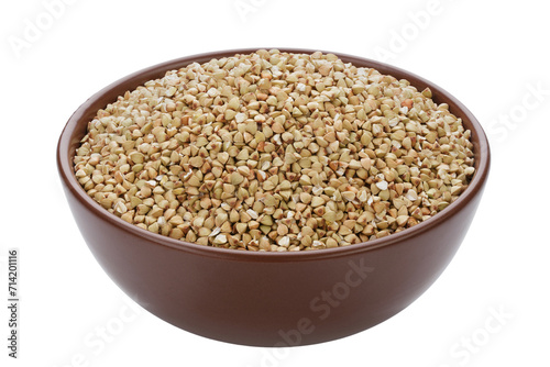 Unroasted buckwheat in a bowl. Isolated on a white background.