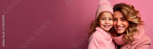 portrait of a 30 years old mother and her 7 years old daughter daughter with pink background, studio shot.  Image with copy space. Generative AI