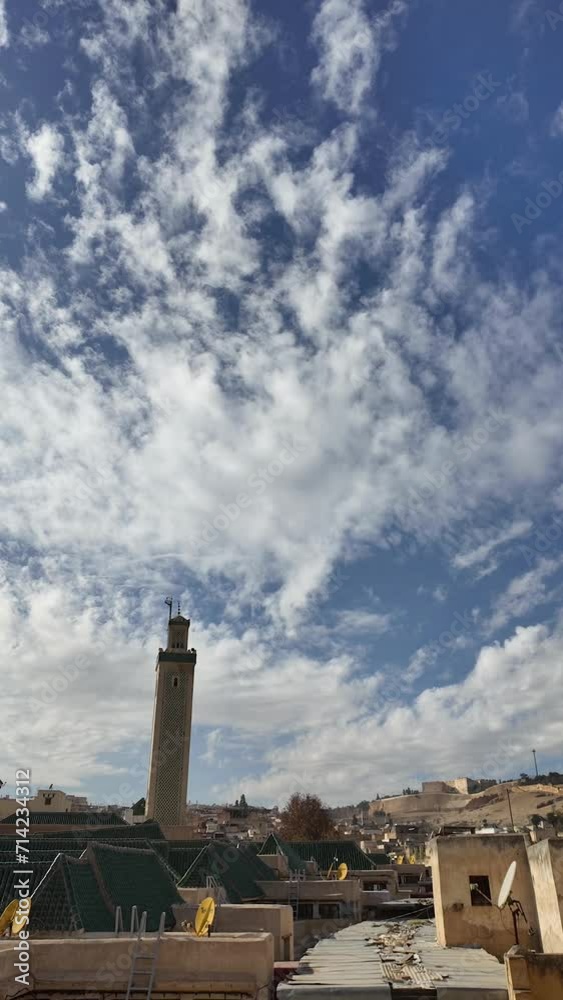 Timelapse of the minaret of Bou inania Madrasa on a sunny day. Clouds are moving. Example of historic Moroccan architecture. Timelapse of the minaret of Bou inania Madrasa on a sunny day. Clouds are moving. Example of historic Moroccan architecture.