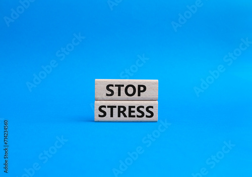 Stop Stress symbol. Concept word Stop Stress on wooden blocks. Beautiful blue background. Business and Stop Stress concept. Copy space