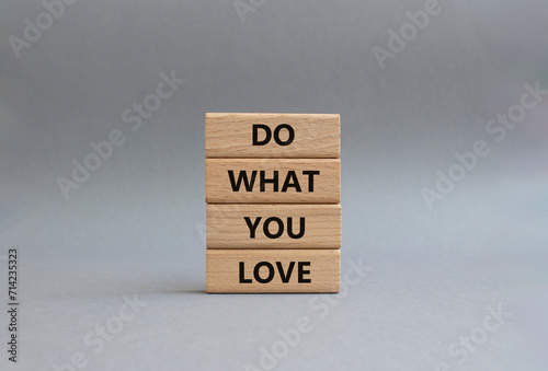 Do what you Love symbol. Concept words Do what you Love on wooden blocks. Beautiful grey background. Business and Do what you Love concept. Copy space