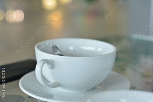 A cup of coffee on the table in a coffee shop 