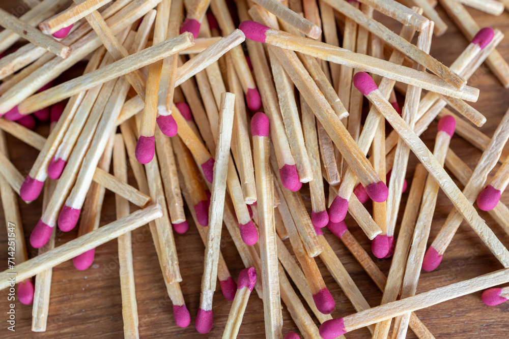 Many matches on the wooden table, closeup