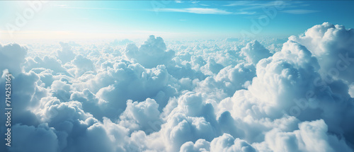 Expansive View Above the Clouds: A Serene and Majestic Ocean of Fluffy White Clouds Under the Clear Blue Sky