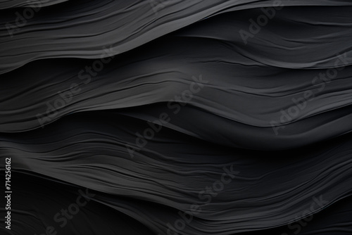 Abstract black fabric texture background with soft waves pattern