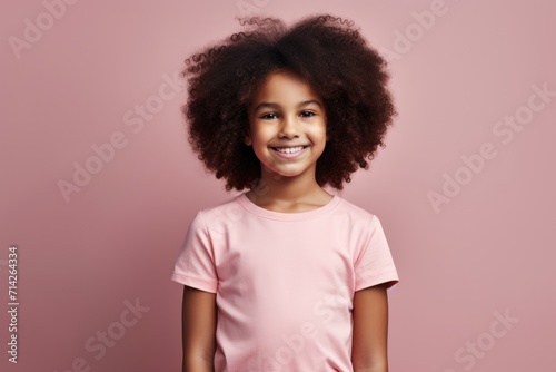 Optimistic girl with afro curls holds card © darshika