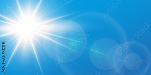 Blue sky background with bright sun and lens flare