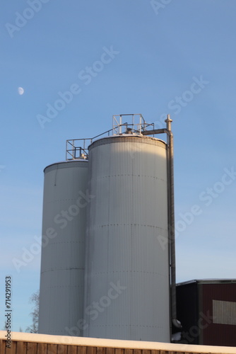 grain storage tank. industrial plant with chimney.