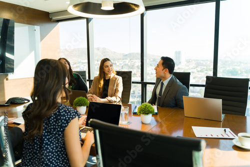 Group of businesspeople talking to each other during a meeting
