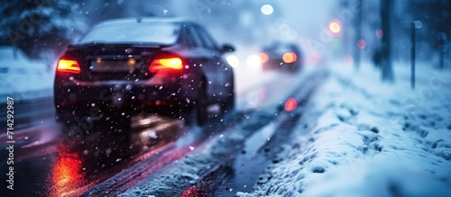 Car driving in inclement, slippery conditions. © 2rogan