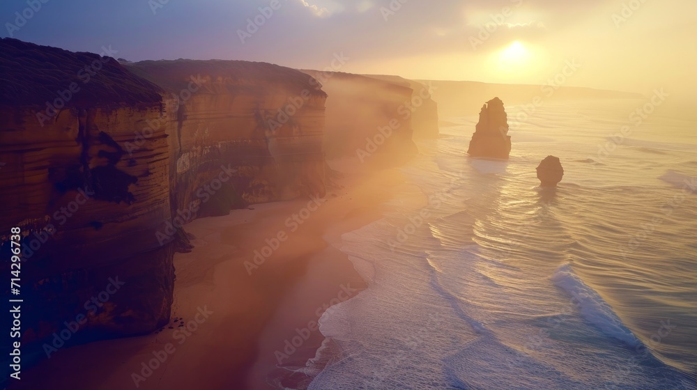 AERIAL: Spectacular drone point of view of the famous 12 Apostles beach in Australia on a sunny summer evening. Golden sunshine illuminates the cliffs and other rock formations on coast of Australia.  - obrazy, fototapety, plakaty 