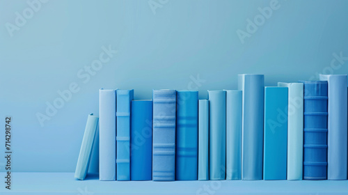 Farblich Abgestimmte Bücherreihe auf Hellblauem Hintergrund photo