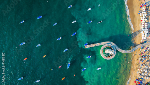 Aerial top down of Playa De Los Muertos beach and pier close to famous Puerto Vallarta Malecon, mexico riviera Nayarit