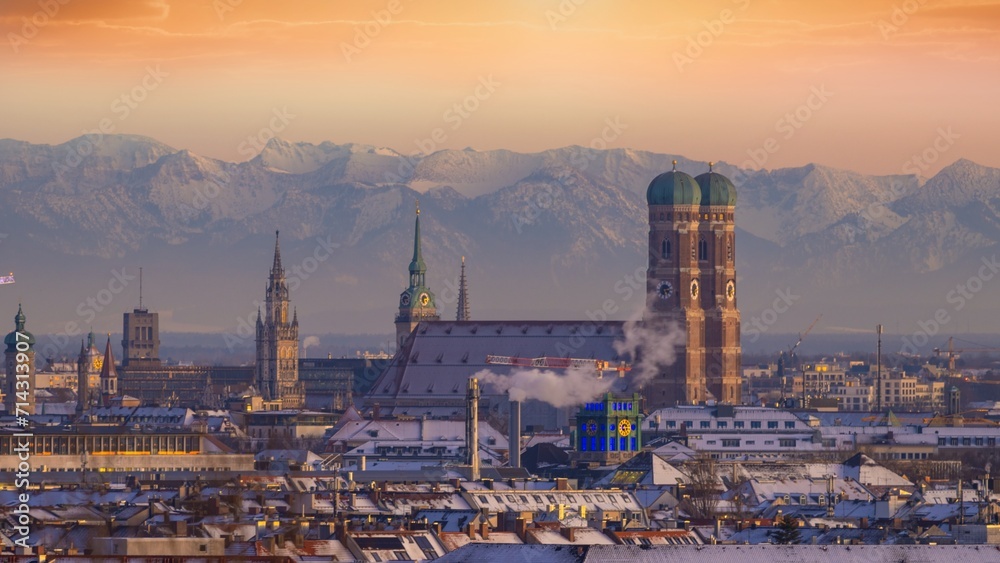 Fototapeta premium Munich cityscape aerial view at sunset, munich frauenkirche germany city alps mountains.