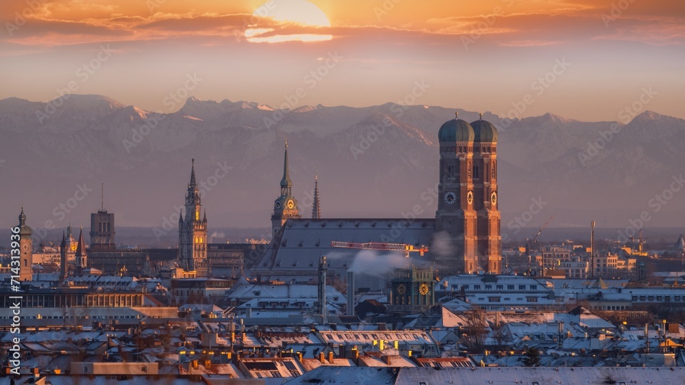 Fototapeta premium Munich city skyline aerial view, munich cathedral church frauenkirche marienplatz sqaure in background alps mountains. munich germany.