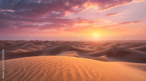 the sun is setting over a desert with sand dunes in the foreground and pink clouds in the sky over the sand dunes in the foreground  with a pink and blue sky.